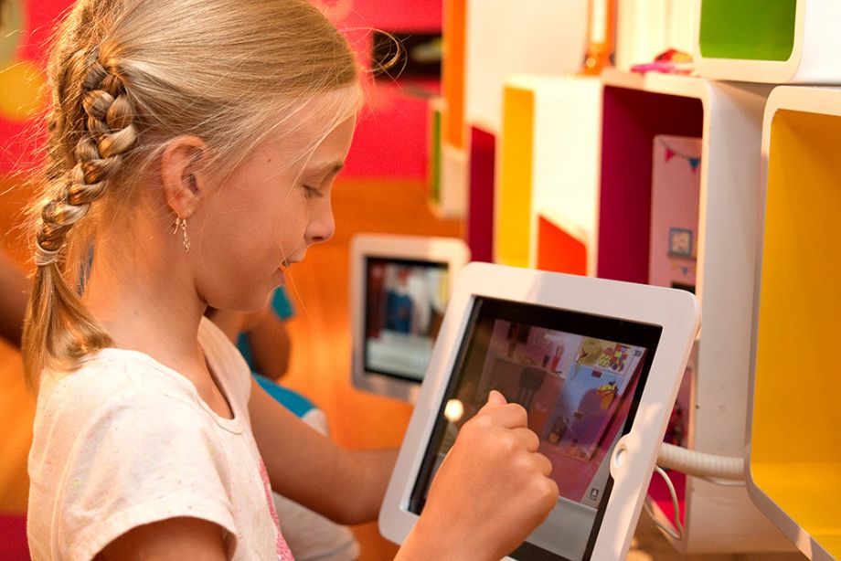 Girl plays on iPad in the Animation Studio
