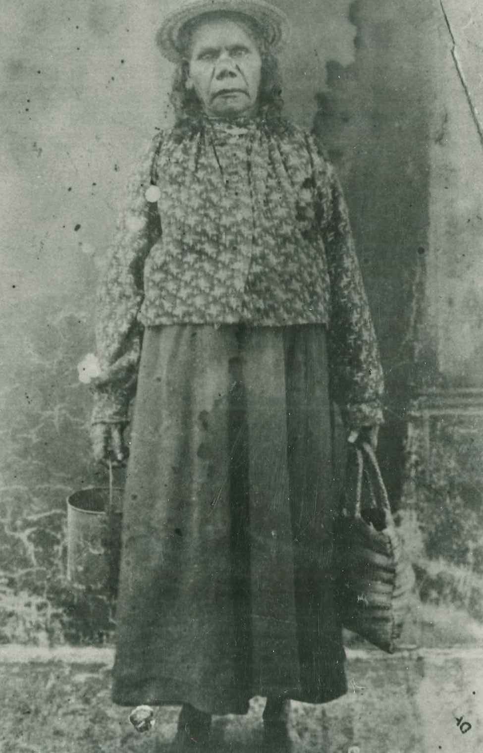 Portrait image of Maria, Queen of Childers carrying to bags 