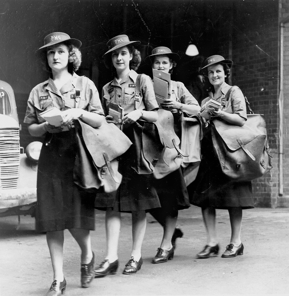 4 postwomen with their mail bags and bundles of mail, Brisbane February 1943.