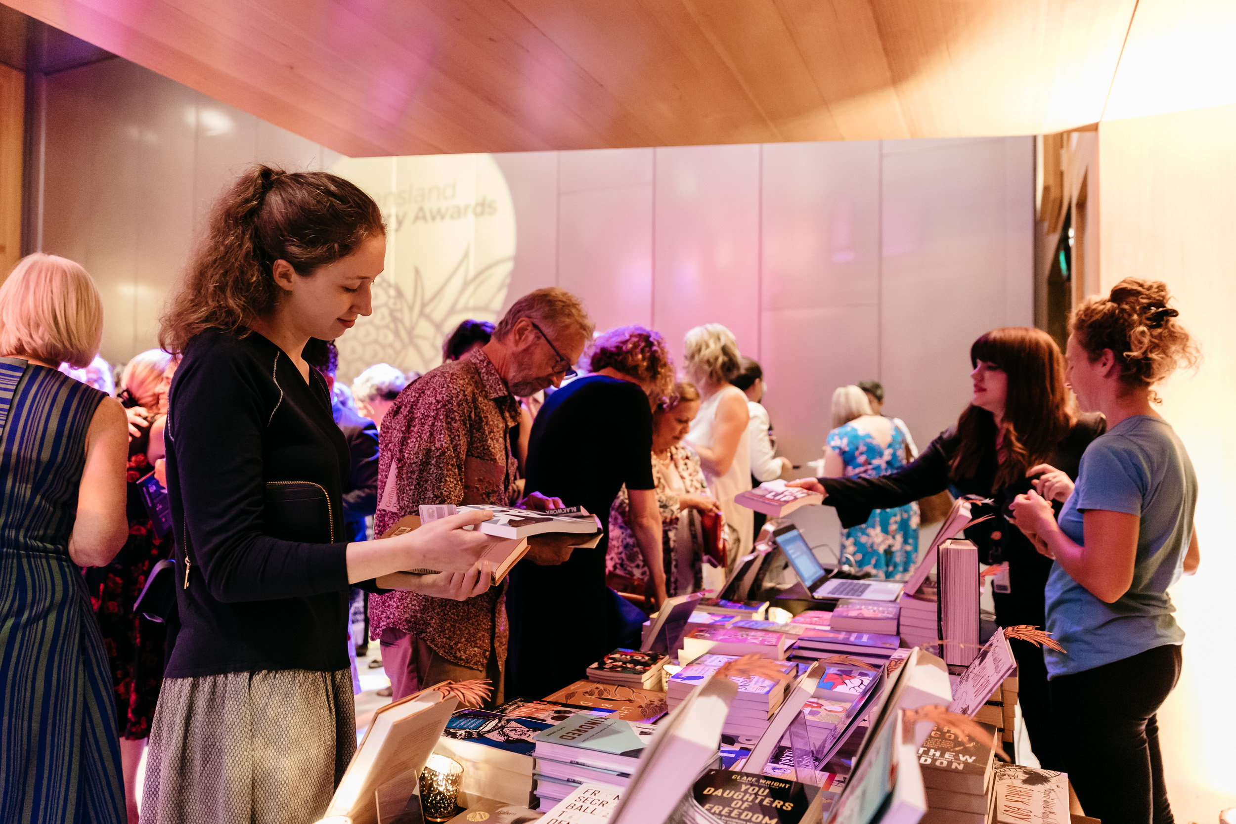 People browsing books at Queensland Literary Awards 2019