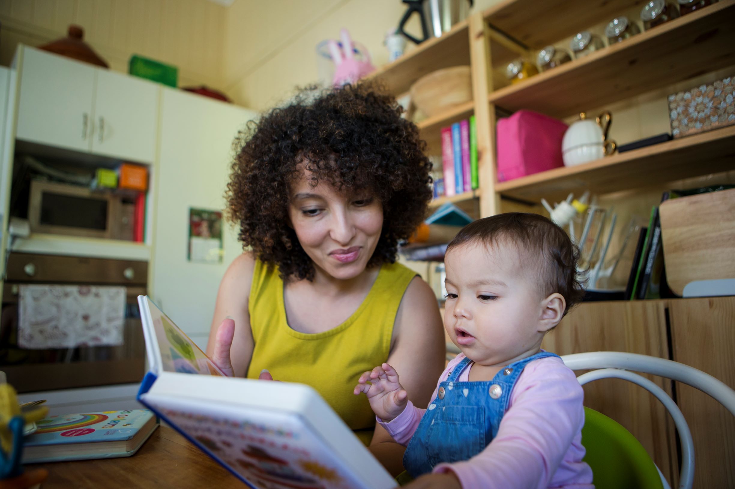 Mother and baby reading a board book