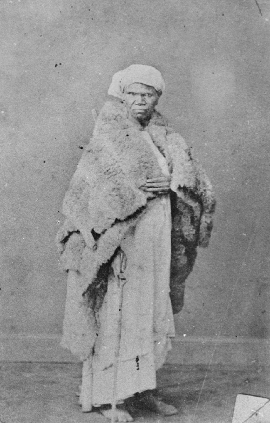 One of the few photographs of an unnamed Aboriginal woman wearing a possum skin cloak in South East Queensland.