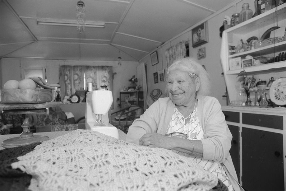 Evelyn Parter, an Australian South Sea Islander, sitting inside her home in Joskeleigh, Queensland 