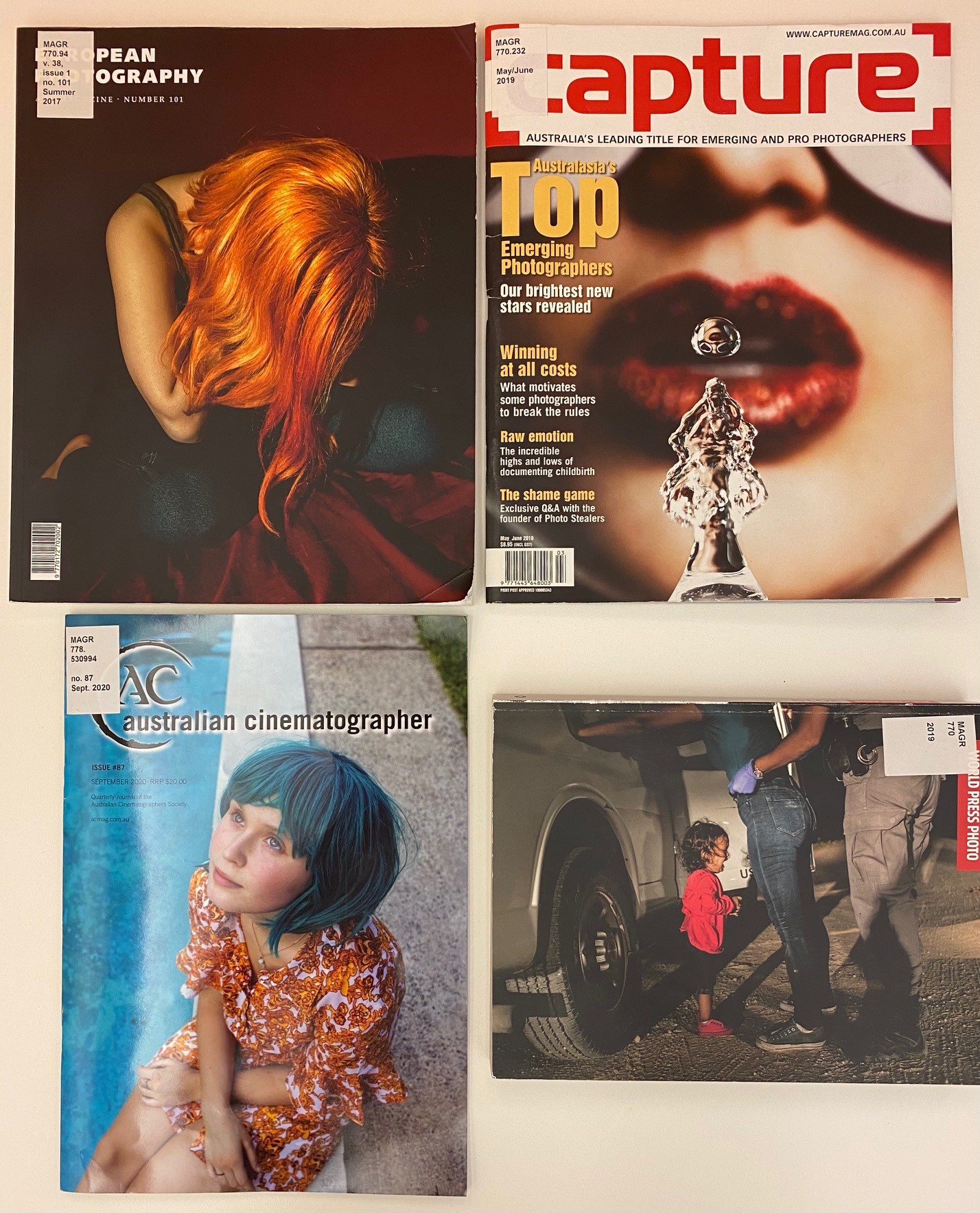 Photo of four photography magazines held at State Library of Queensland, European Photography, Capture, Australian Cinematographer and World Press Photo