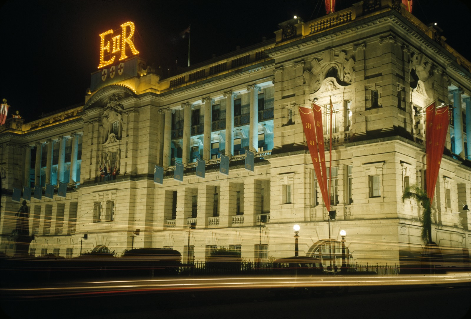Colour photograph of the Executive Building illuminated for the 1954 Royal tour in Brisbane