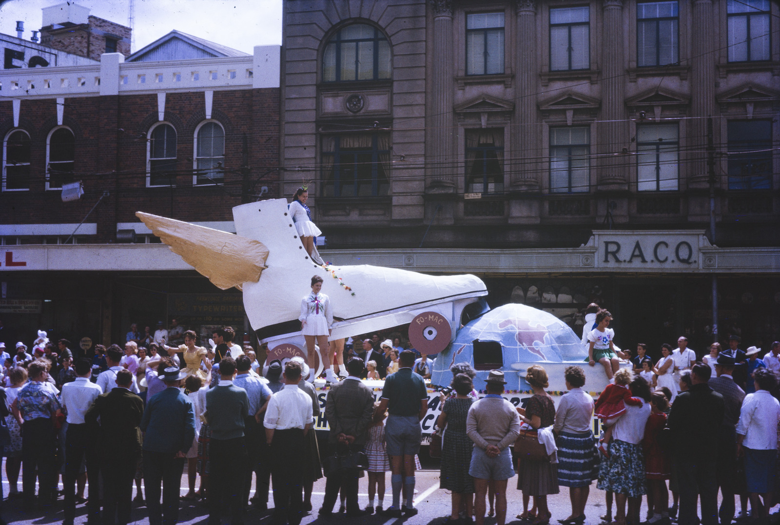 Parade float in the shape of a winged roller skate taking part in the Warana Festival, ca. 1965