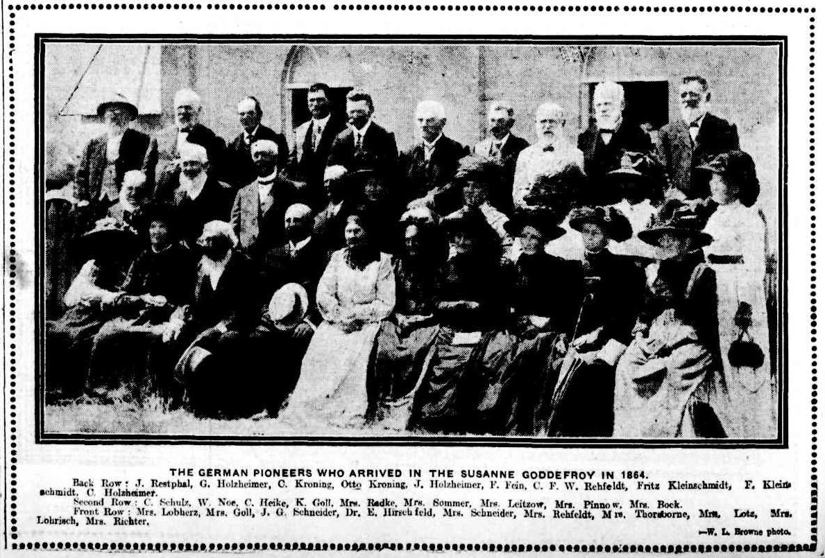 Newspaper photograph with caption of a group of male and female German pioneers who arrived in 1864, published "Brisbane Courier" 31 January 1914