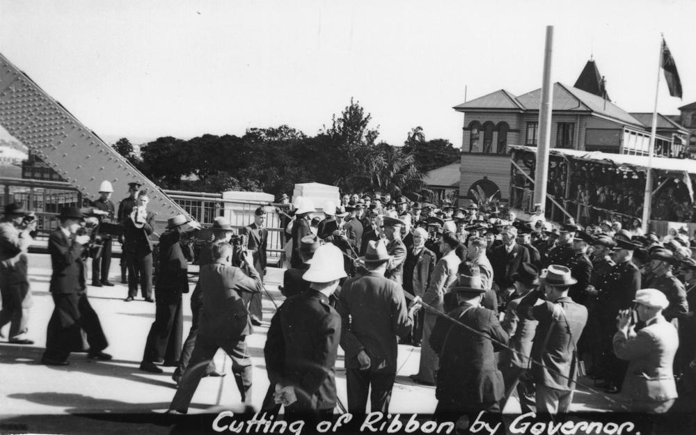 A large crowd of people in 1940s clothing gathered for an opening ceremony for the Story Bridge