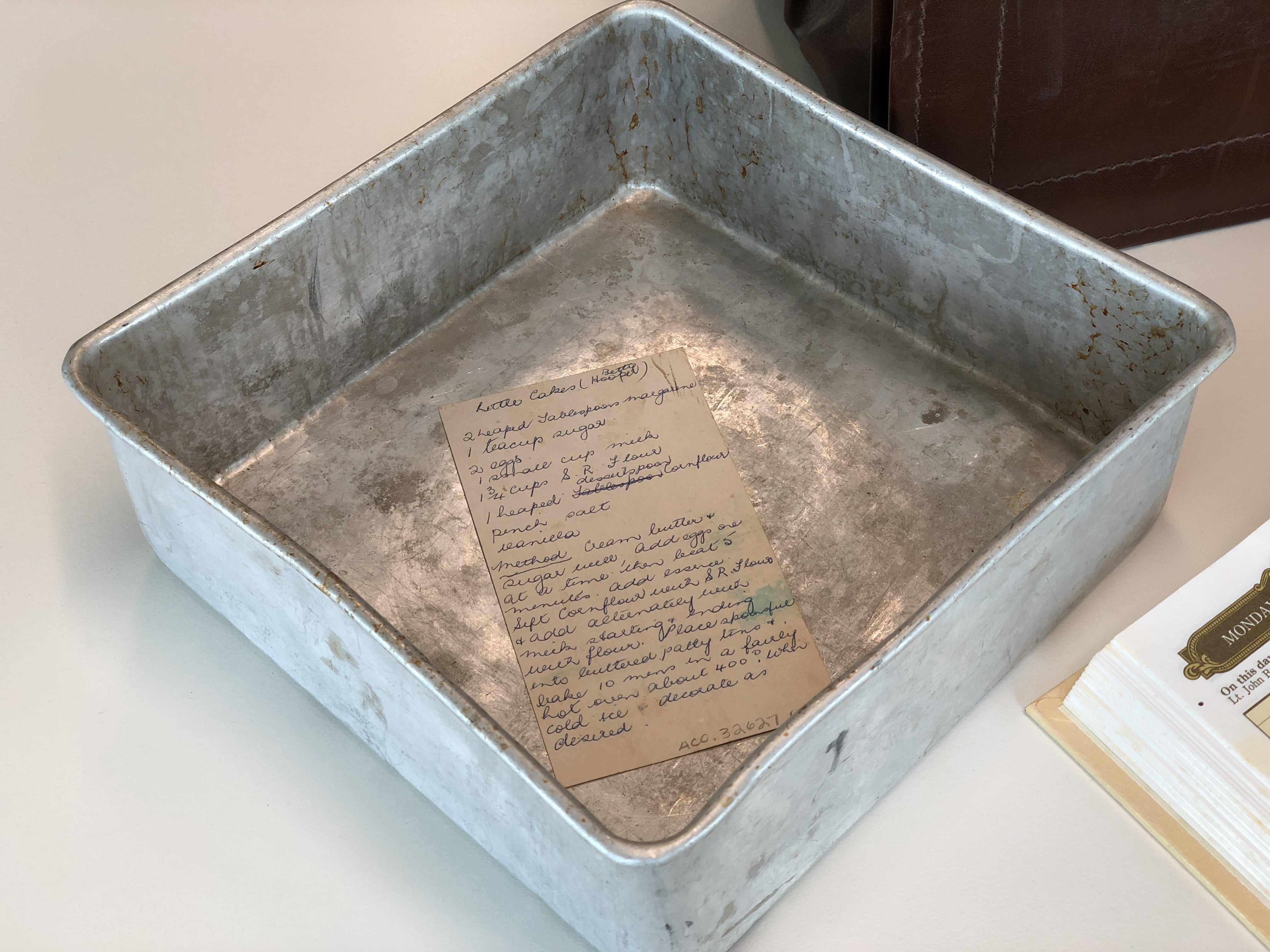 Lady Flo's battered cake tin and handwritten recipe. 