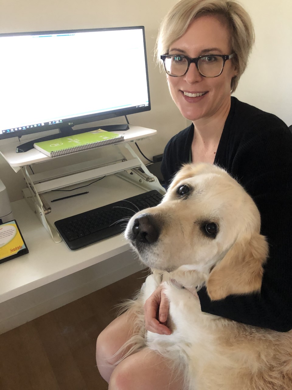 Library technician Kristina Read and her dog Moose, working from home - sitting at a computer together