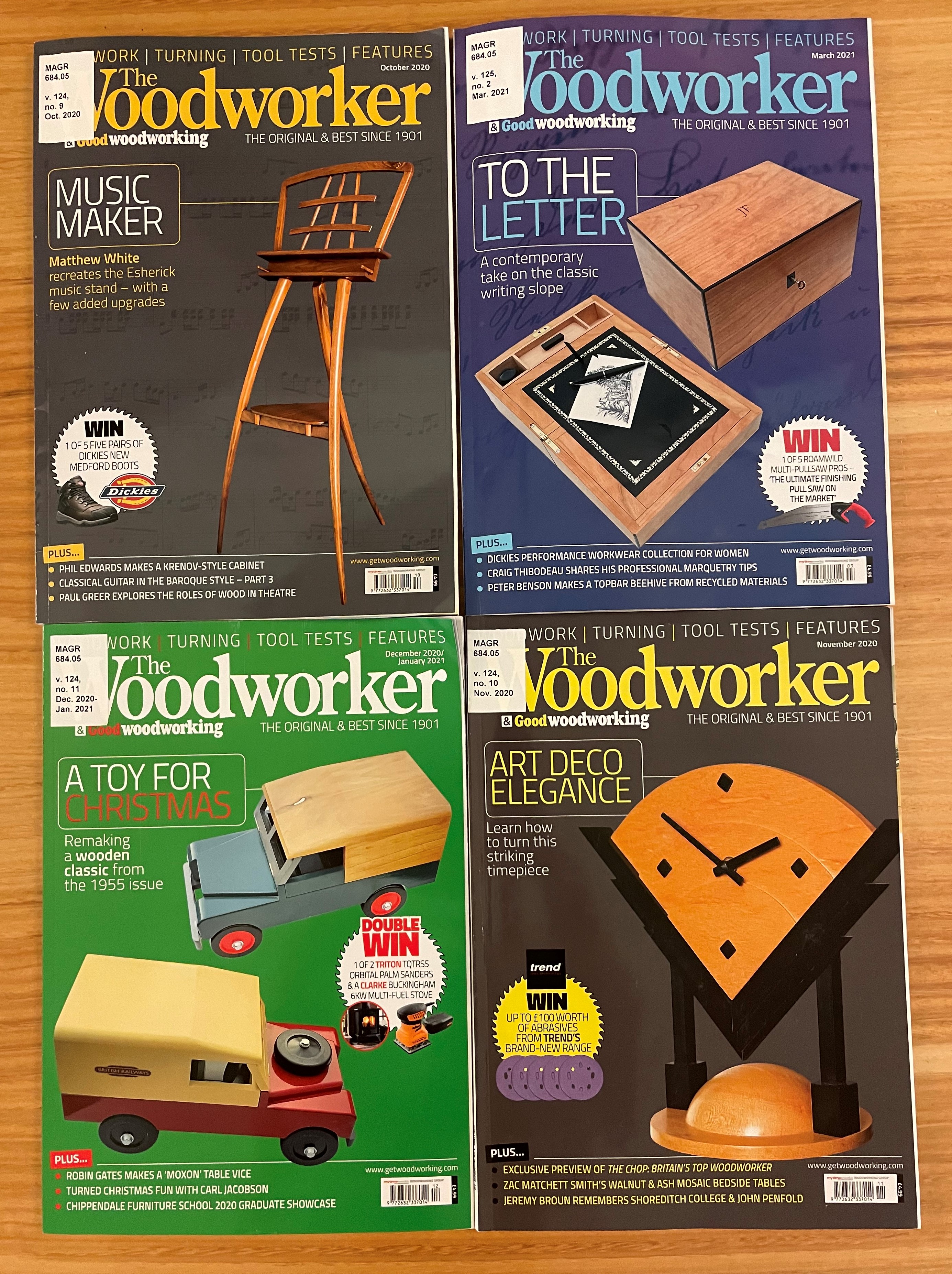 Image of four front covers of "The Woodworker & goodwoodworking" magazine displaying various wooden items