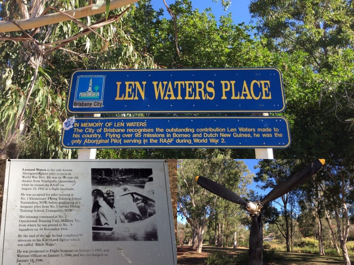 A blue sign with yellow writing saying "Len Waters Place" in a park