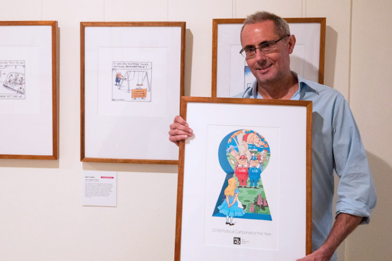 Matt Golding holding his winning artwork.
