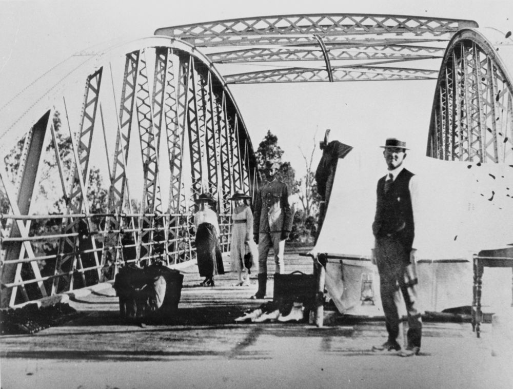 People gathering at the border crossing on a bridge during the Spanish Influenza pandemic