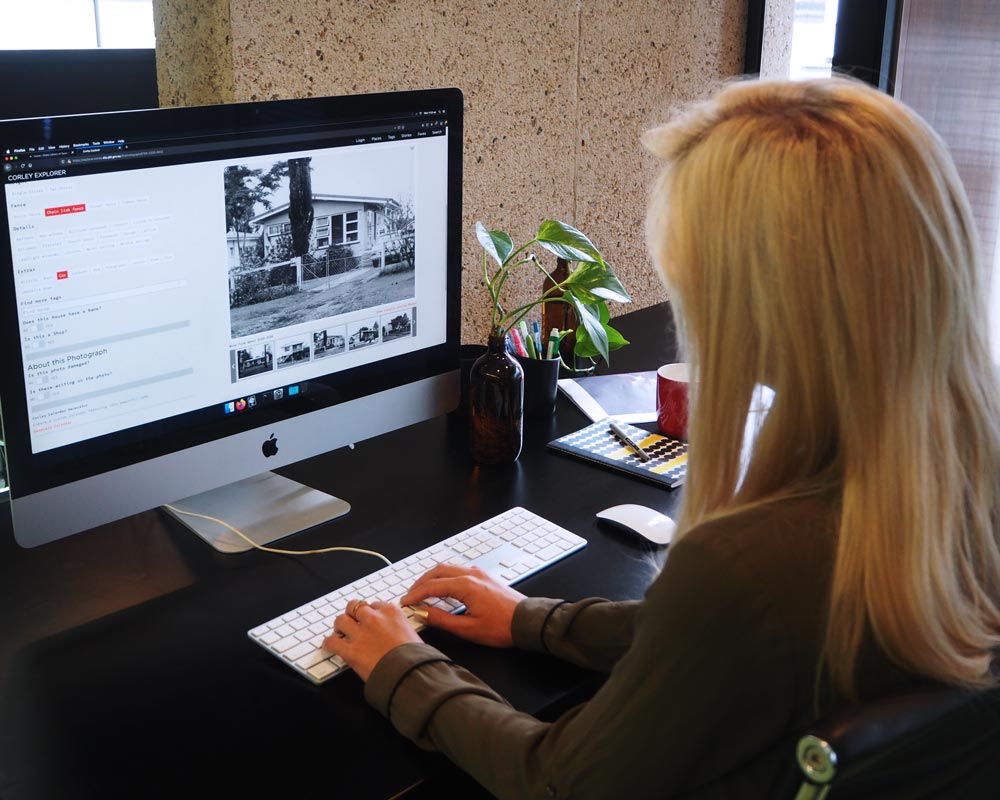 Woman using the Corley Explorer on computer.
