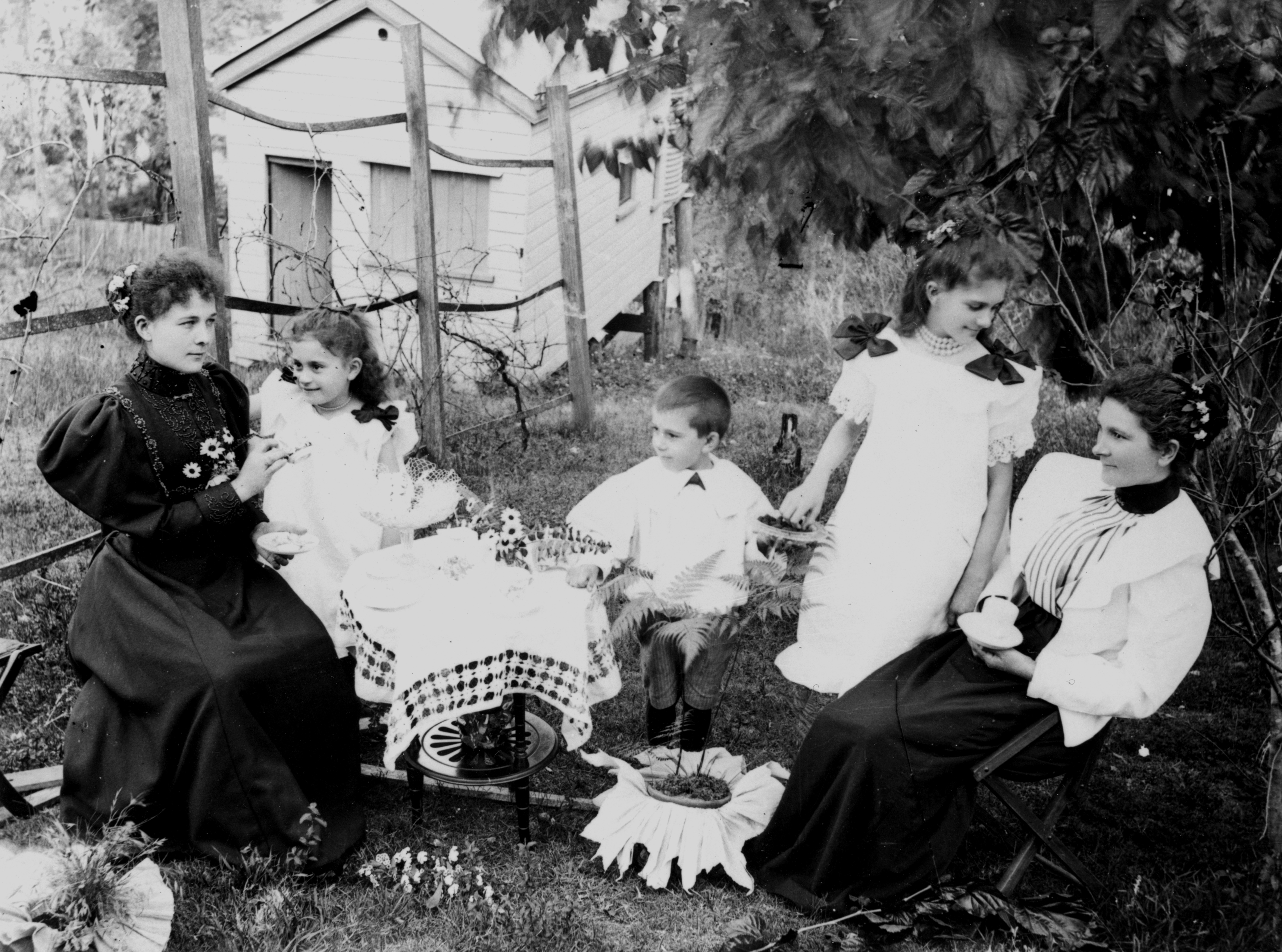 Taking tea in the garden, 1890s, Photographer: Unidentified, John Oxley Library, State Library of Queensland. Negative number: 43999.