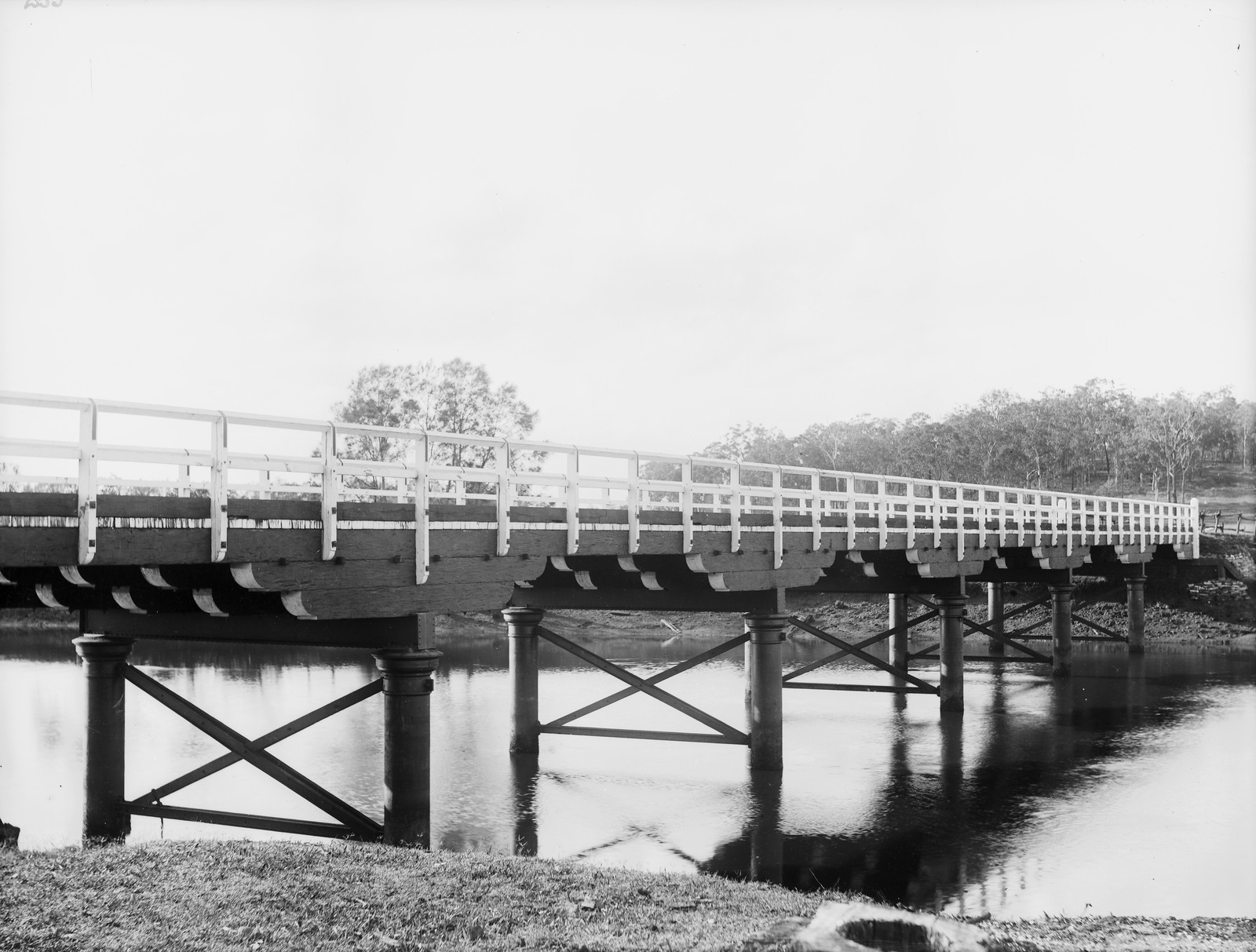 Bridge spanning an unidentified river in Queensland, 1880s-1900s.