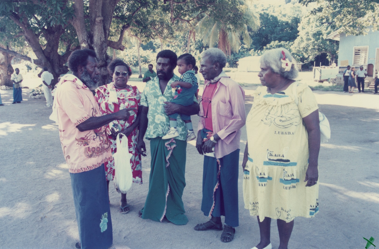 A group of torres strait islander people wearing colourful and floral clothing