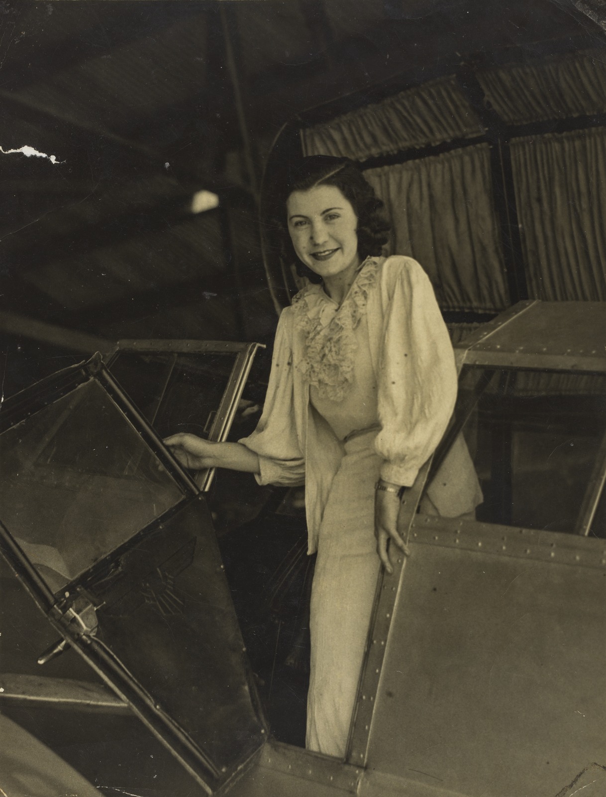 Ivy May Pearce in the cockpit of her aircraft, Archerfield, 1935