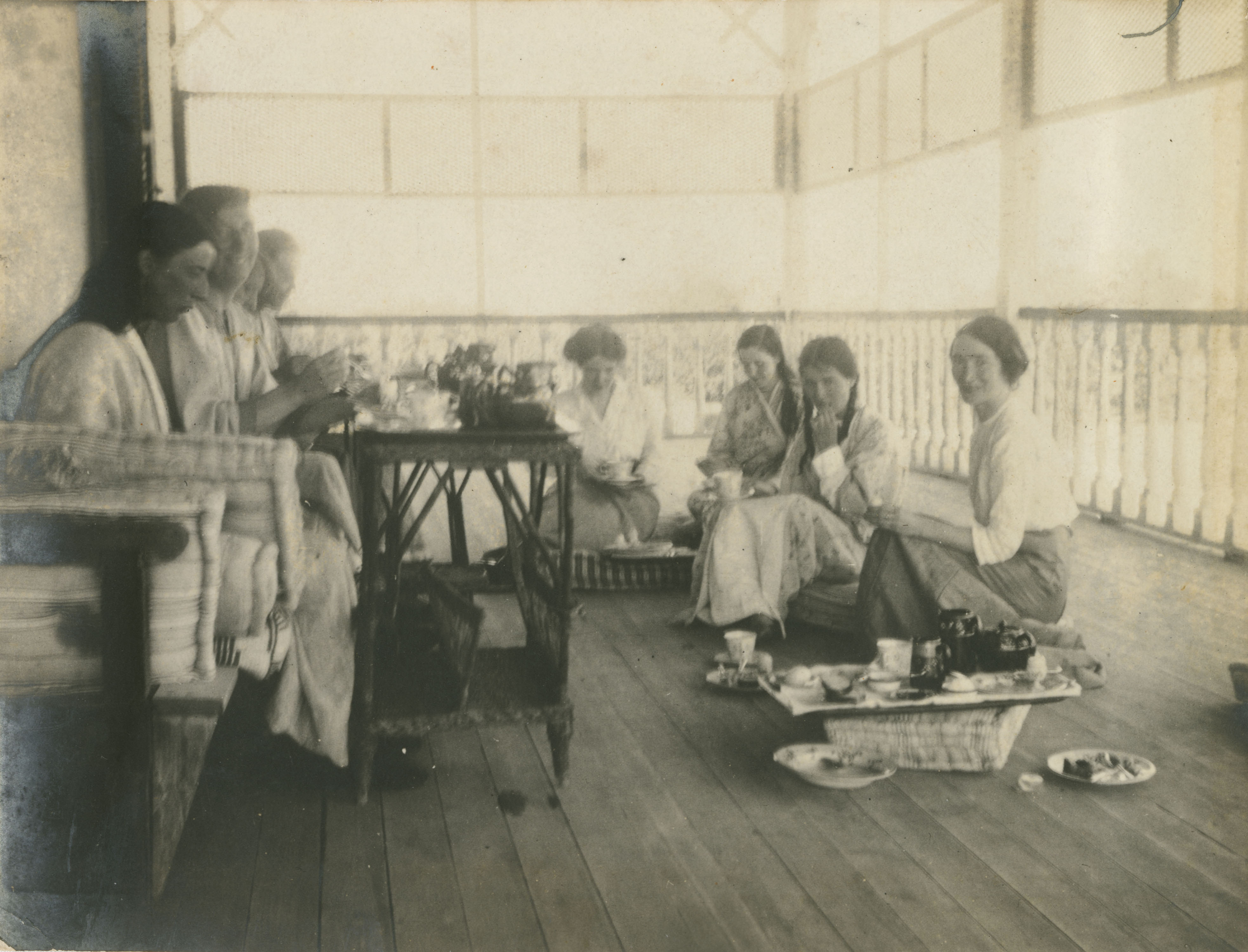 Group of women eating on verandah in Egypt, ca 1915.