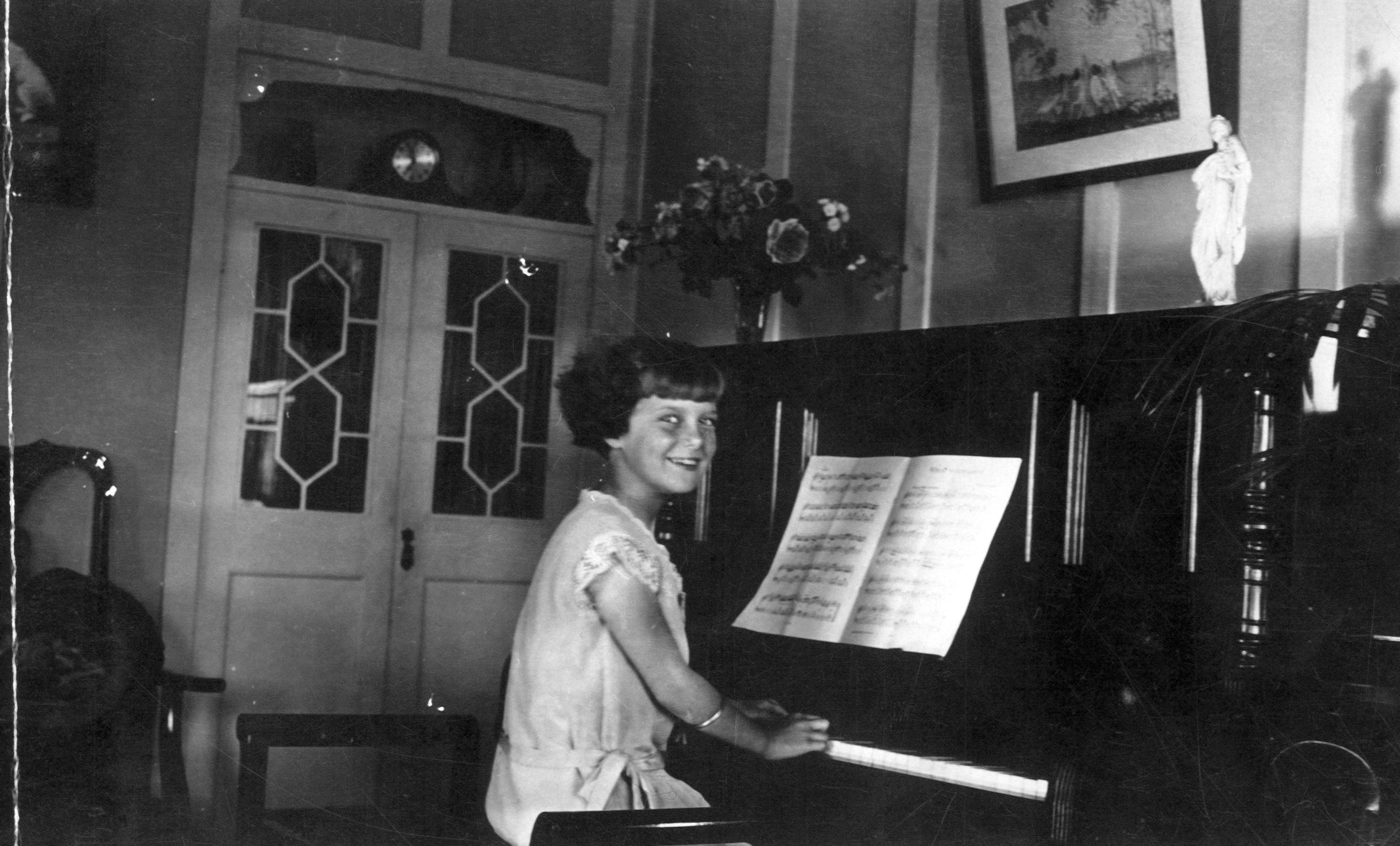 A young Letty at the piano. 