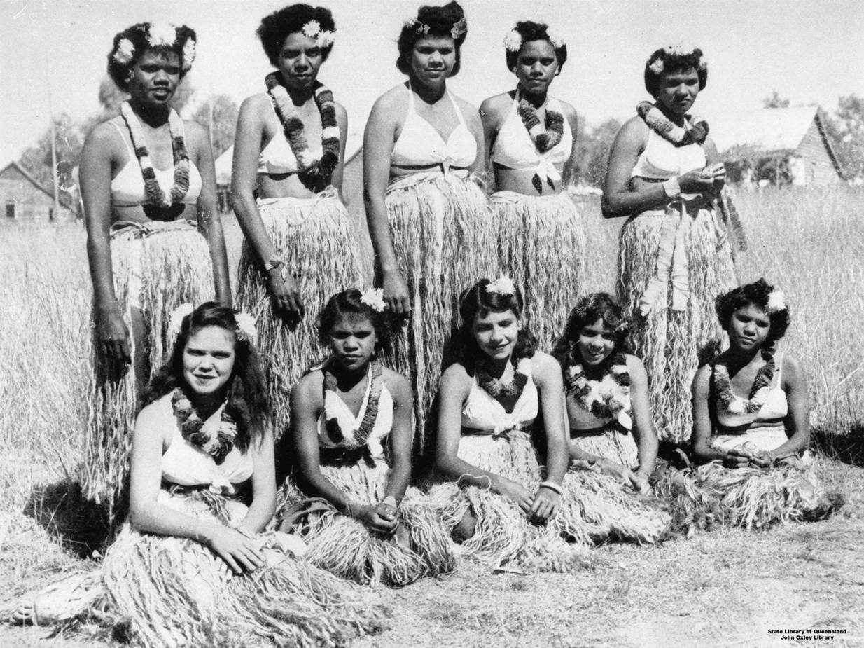 A group of ten women in a field