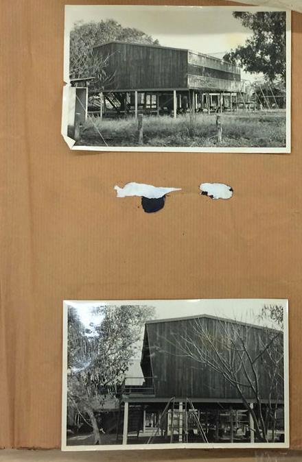Two photos of wooden houses in James Peter Birrell's scrapbook 