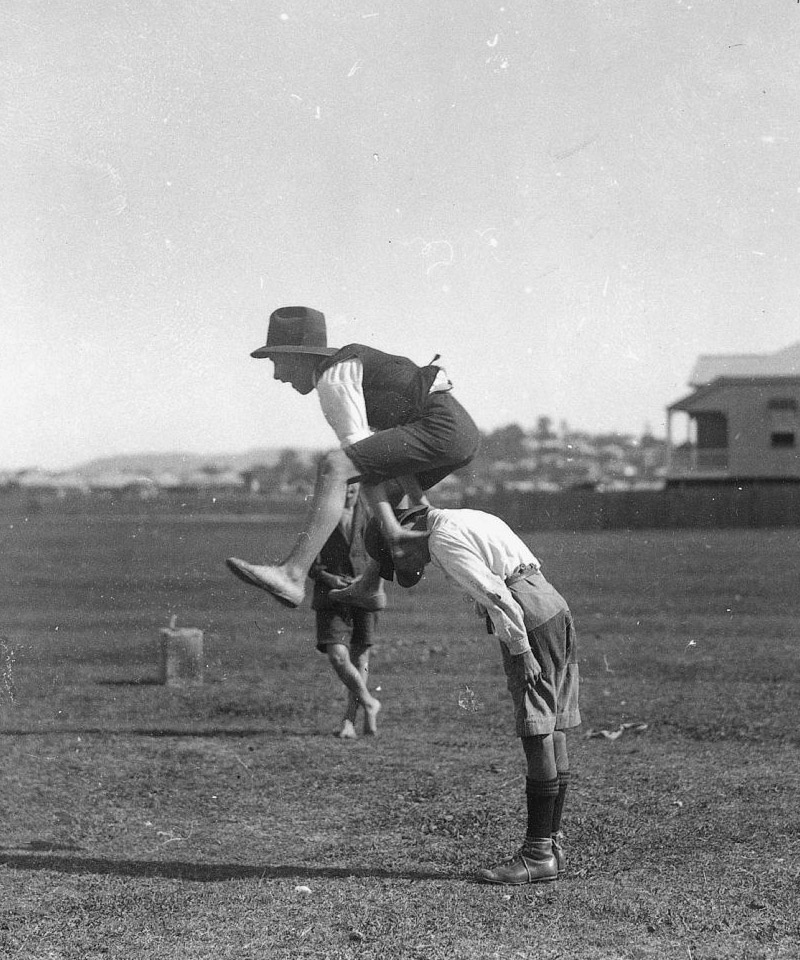 Two boys playing leapfrog, 1910-1920