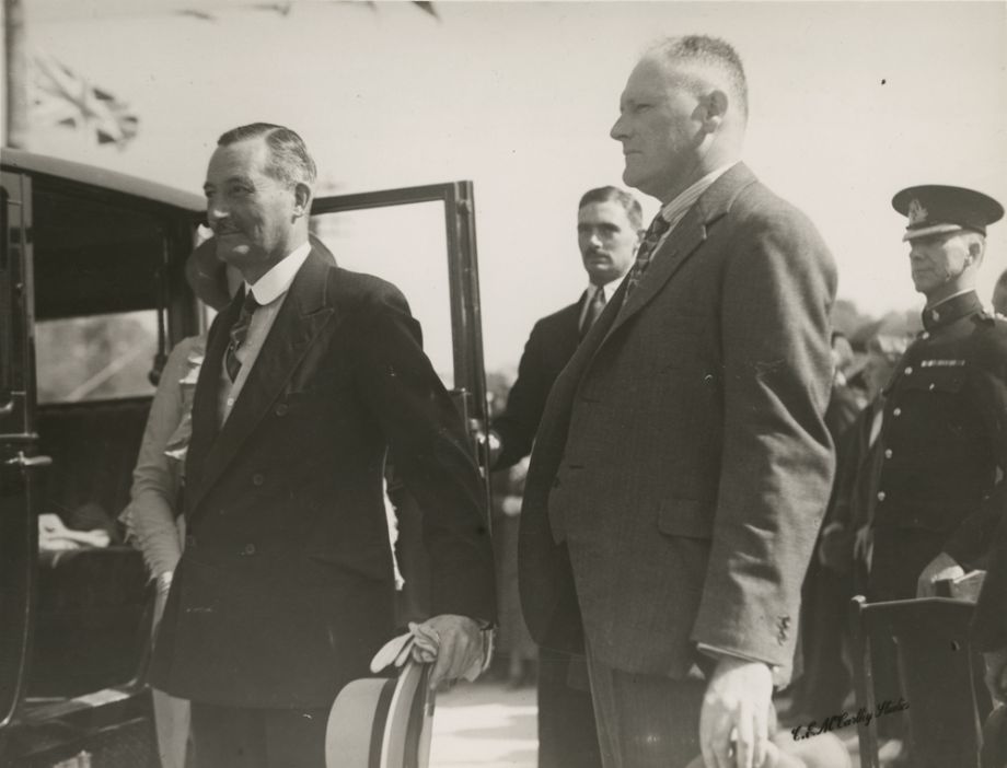 Manuel Hornibrook with Sir Leslie Orme Wilson, Governor, as he is getting into the car to lead the procession of vehicles over the Bridge on Opening Day of the Hornibrook Highway
