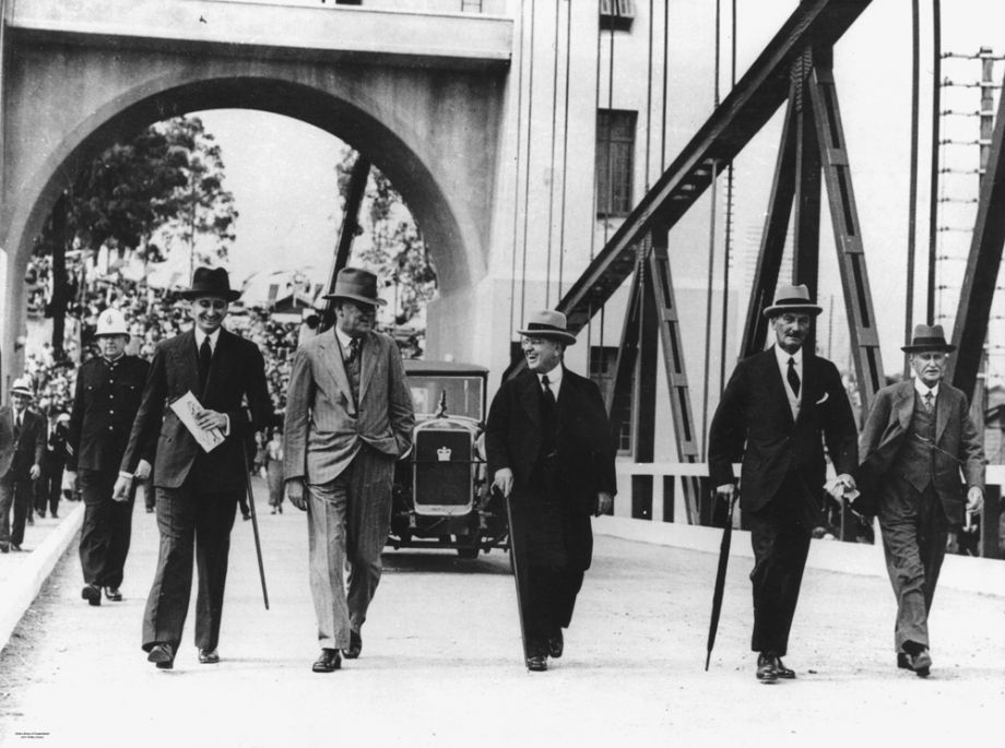 The Queensland legislation that enabled MR to operate a toll bridge was also a catalyst for other enterprising builders to develop toll bridges, such as the Walter Taylor Bridge at Indooroopilly. This photo shows opening day of the Walter Taylor Bridge on 14 Feb 1936, 4 months after the opening of the Hornibrook Highway. Manuel Hornibrook is pictured second from the left in the photo and was reported as being the first person to pay the toll on the Bridge.