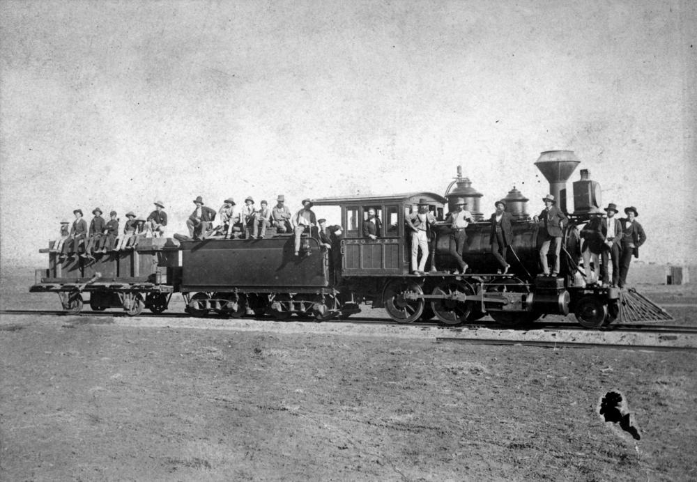 Locomotive named 'Pioneer' on the Western Railway construction site between Roma and Mitchell, ca. 1885. 