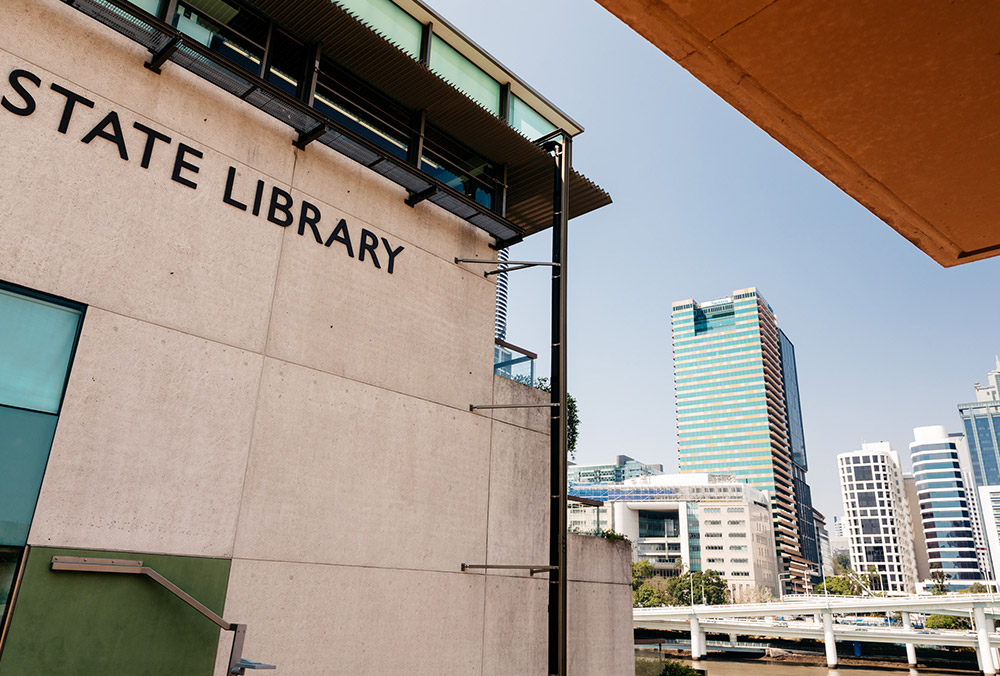 State Library building sign with the Brisbane river in the background ...