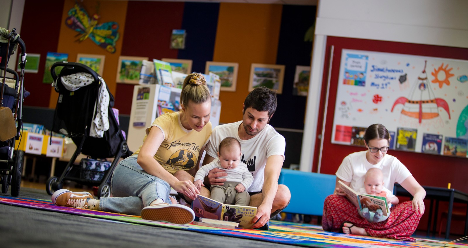 Parents and babies play and reading session at Logan Library