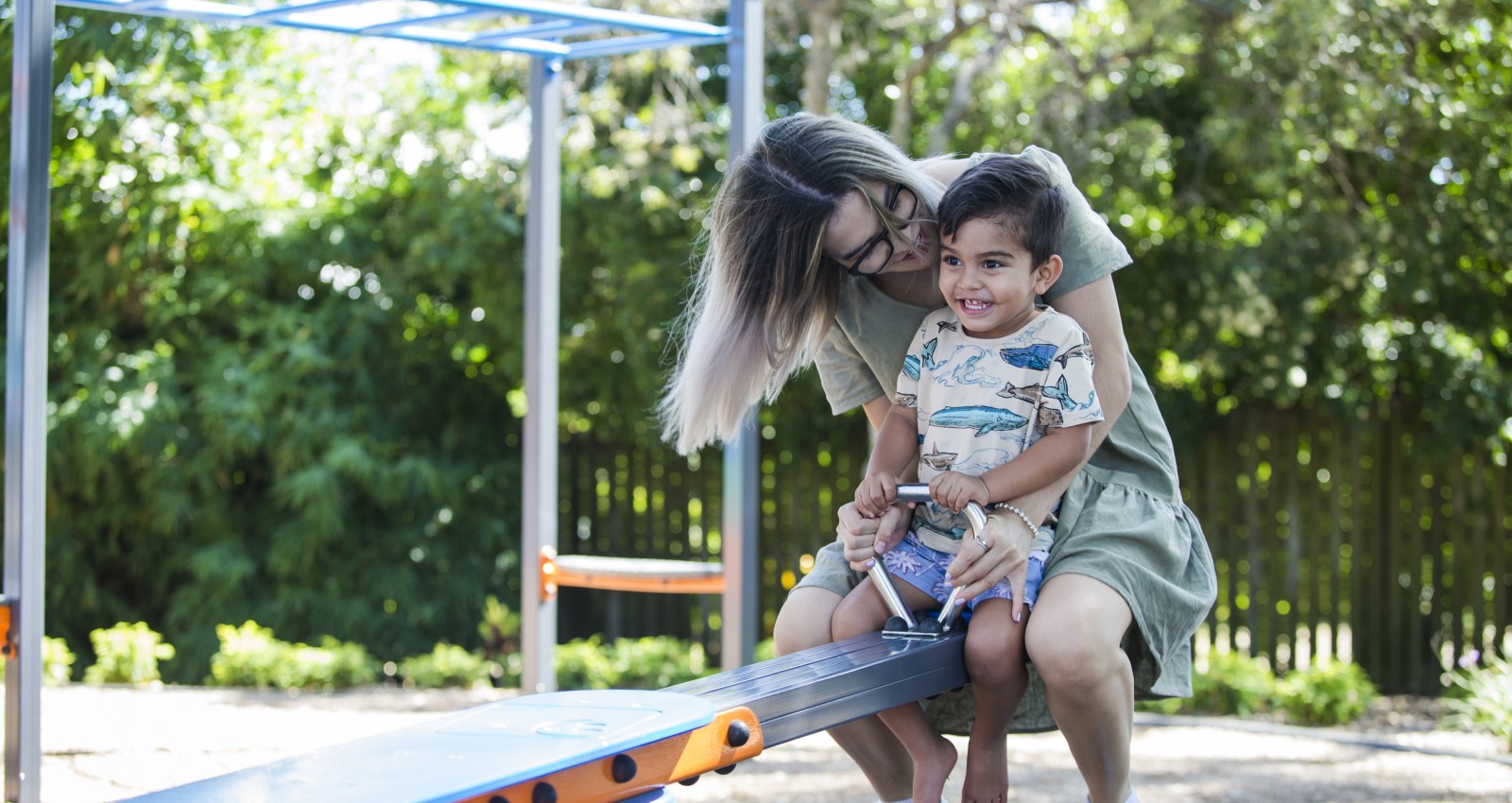 Mother and child playing at the park