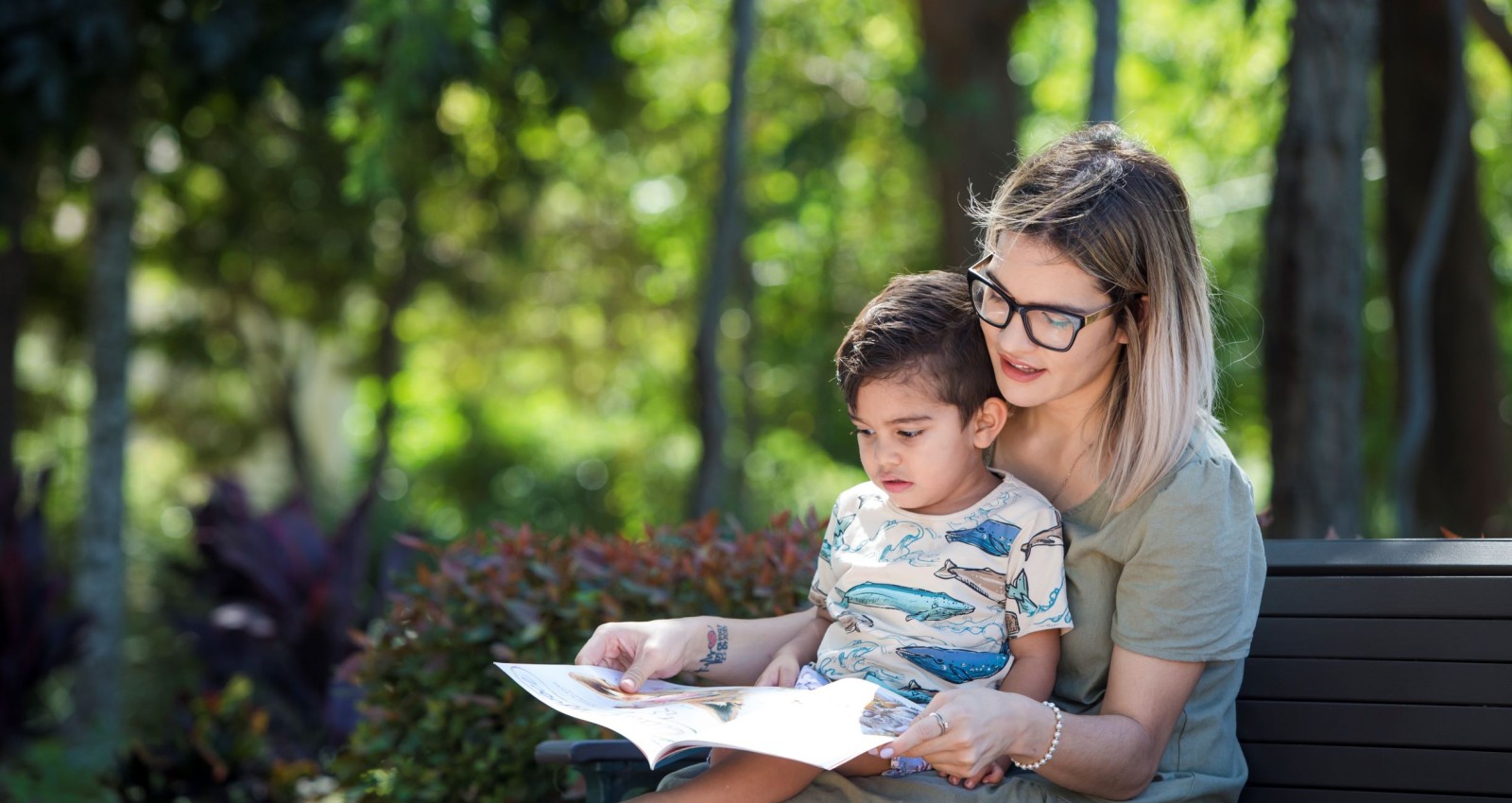 Mother and son reading at the park