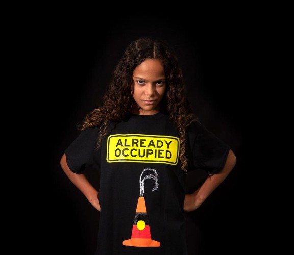 Shiloh Nakach wearing a Libby Harward designed "Already Occupied" shirt.