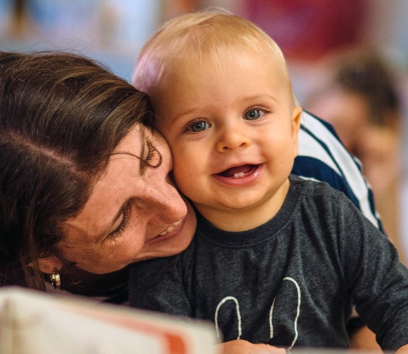 Mum and baby smiling