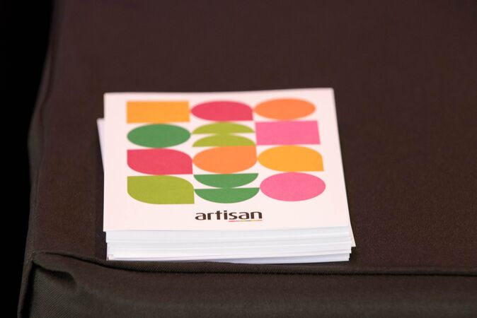 pile of postcards with colourful abstract pattern and artisan wording