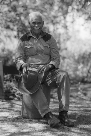 Percy Mooney sitting on a stump in his yard in Habana, Queensland, 2000.
