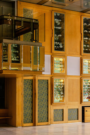 Queensland Terrace at State Library of Queensland; there's a balcony and timber cabinets with teasets inside