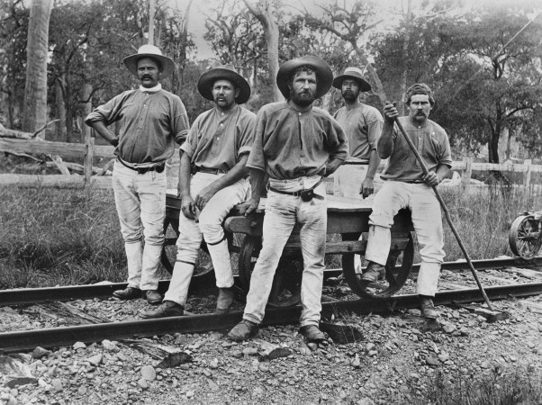 Group of workers on a railway construction trolley, date unknown