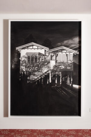 A large black and white drawing of a white Queenslander at night