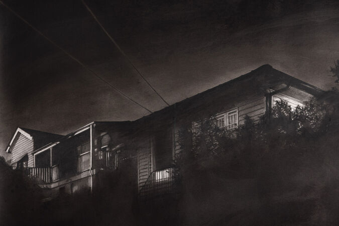 Close up of a black and white drawing of a house at night