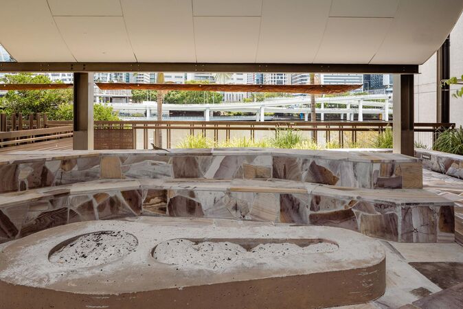 Fire pit in the kuril dhagun Talking Circle, with the Brisbane River in the background.