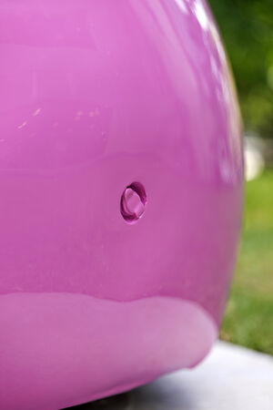 Close up detail of the artwork 'Pink Chairs' by Cj Hendry showing an inflating valve on the side