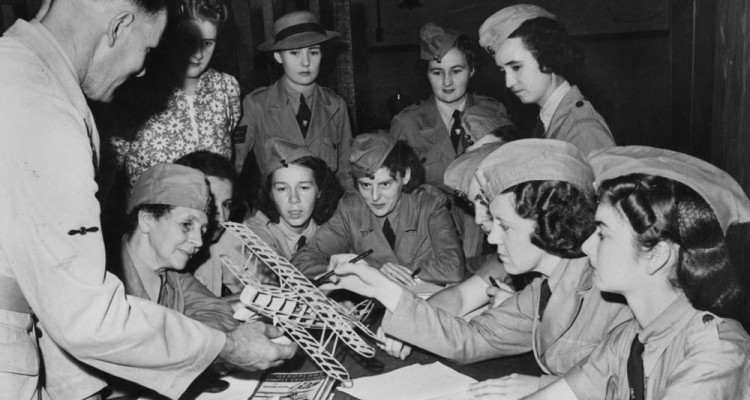 Group of women members of the RAAF gathered around a table learning aviation basics, October 1941