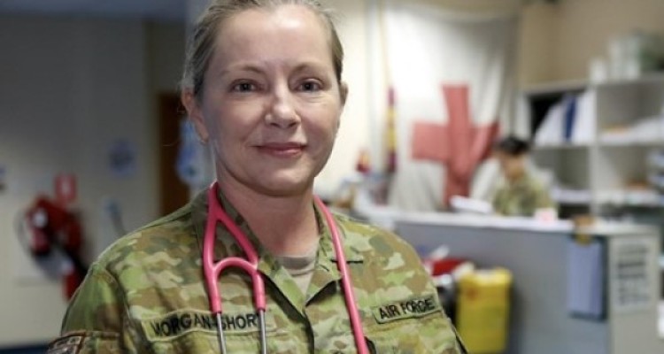 Woman in Australian defence fatigues with stethescope around neck