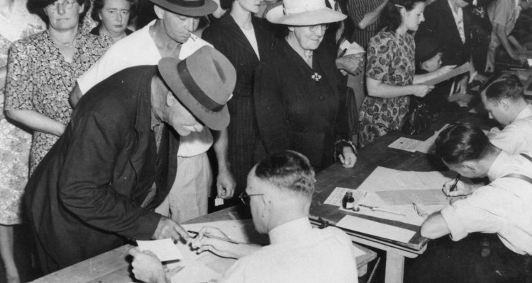 Crowd queuing for rationing cards