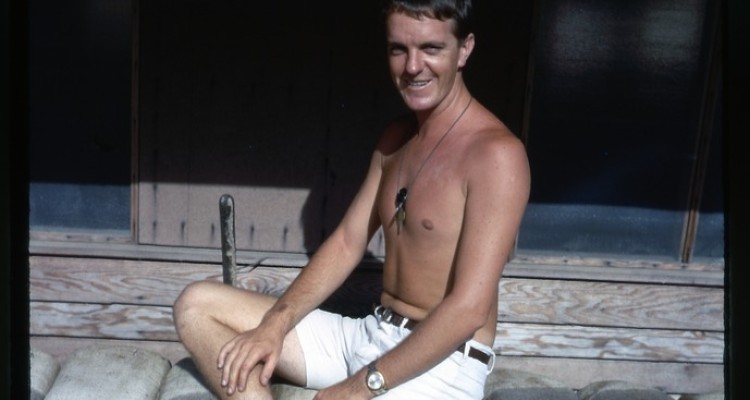 Australian Serviceman sat on sandbags in Vietnam, 1968-69.