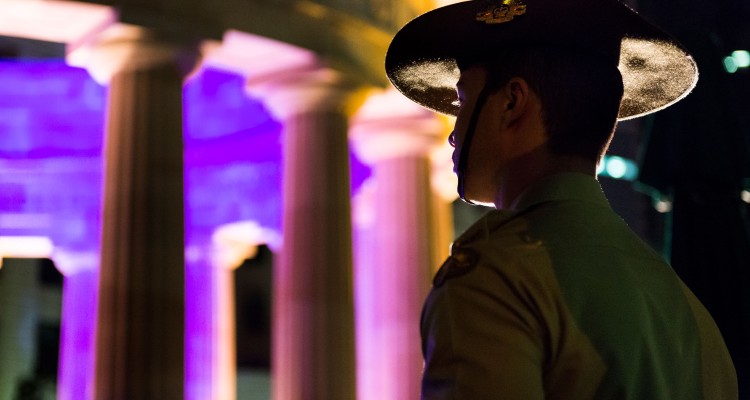 Young soldier standing at attention during the Anzac Day dawn service in Brisbane, 2014